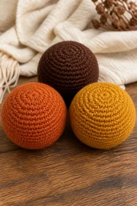 Crochet Autumn Baby Soft Ball Set featuring colorful, soft crochet balls for infants.