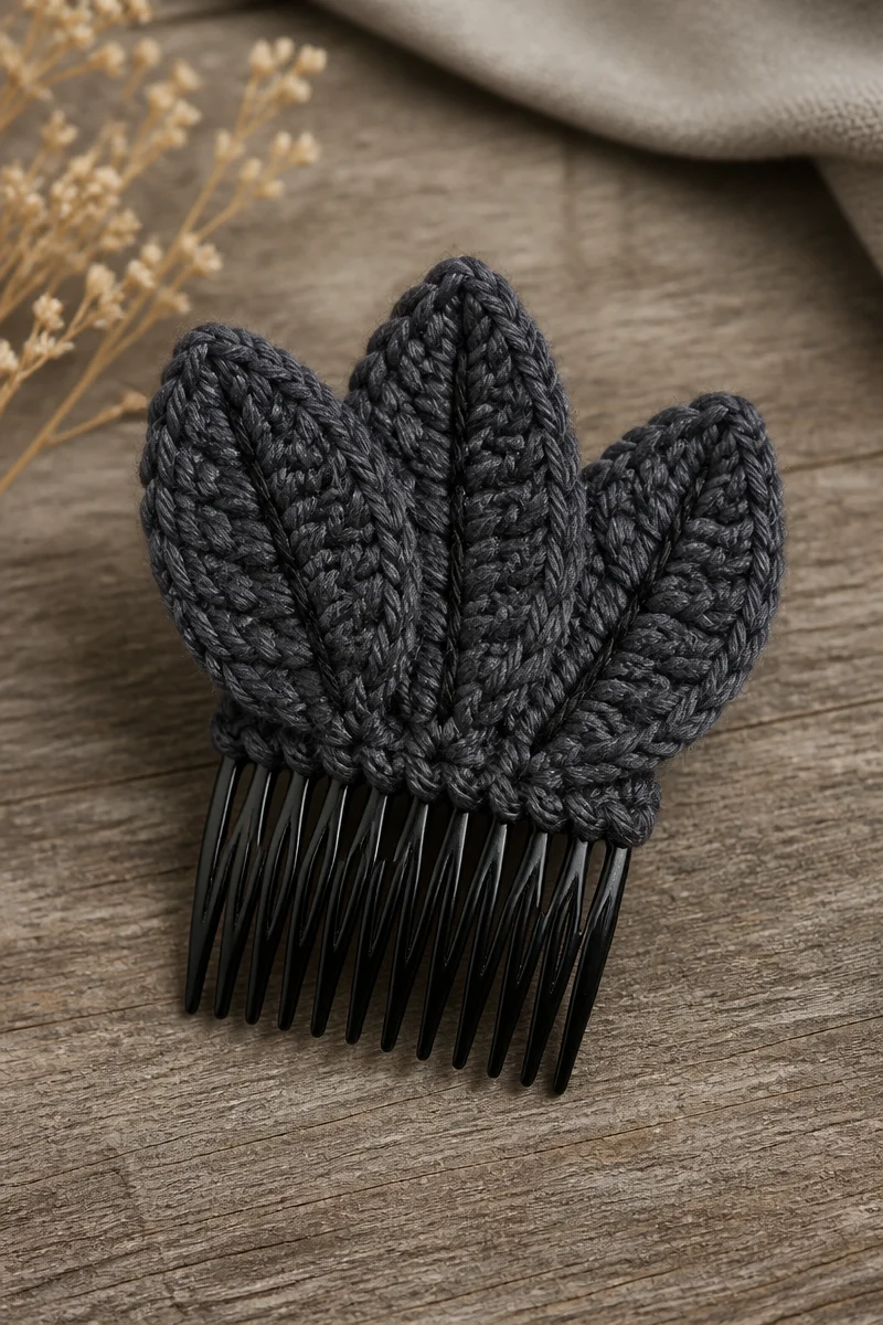 Crochet raven feather hair comb for a mystical hairstyle accessory.